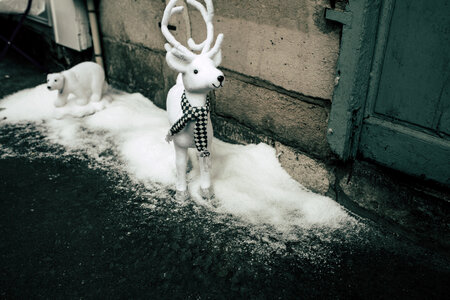 White Animals Toys on a Snow Street Christmas Decoration photo