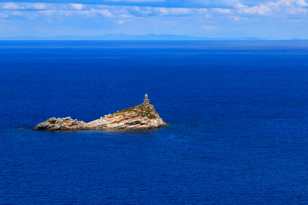 Scoglietto Lighthouse in the middle of the ocean