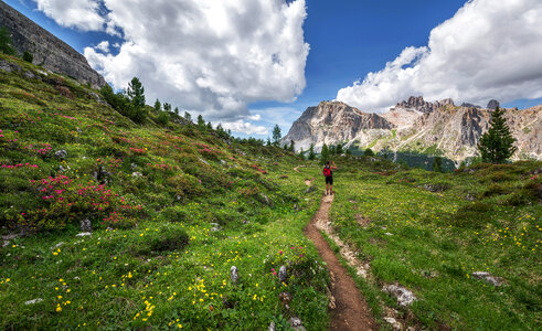 Hiker exploring the Dolomites landscape photo