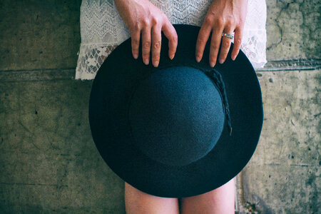 Woman Holding Hat photo
