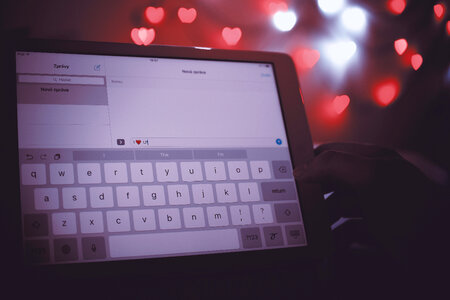 1 Valentine’s Day, Detail of screen of tablet with a message “I love you” photo