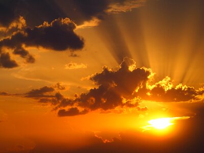 Sunset clouds rays photo