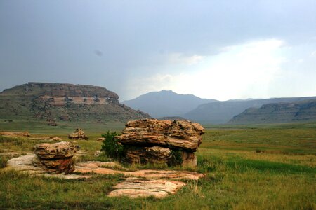 Eminent storm faroff mountains green grass