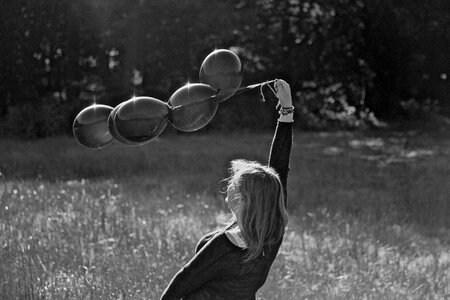 Girl balloons black white photo