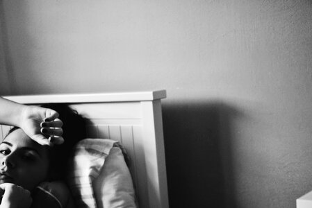 Black And White Image Of A Woman In Bed photo