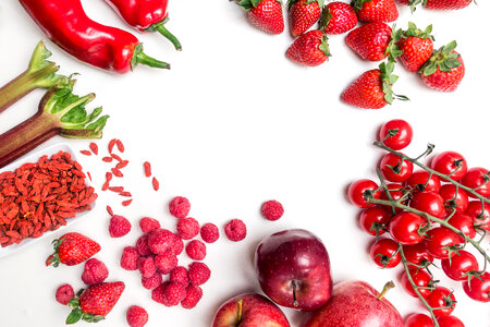 Red fruit and vegetables on a white background