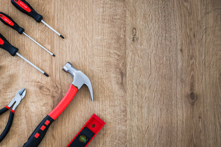 1 Construction tools on the wooden background. photo