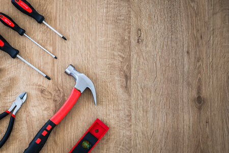 1 Construction tools on the wooden background.
