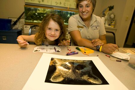 Female Child making mask photo