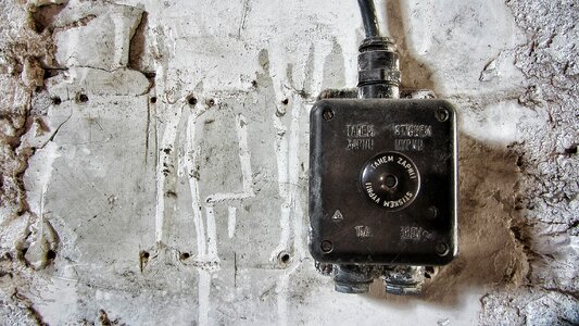 Electrical Junction Box against a Concrete Wall photo