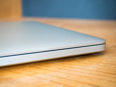 Closed Laptop on Wooden Desk photo