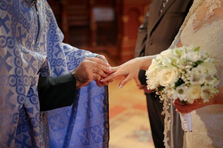 Priest wedding ring wedding bouquet photo