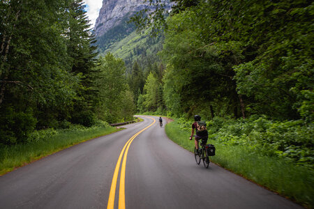 Cyclists in Glacier National Park photo