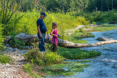 Older man with young girl fishing-2