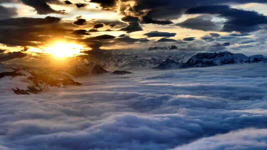 Sunrise at the Alps over a sea of clouds in Austria photo