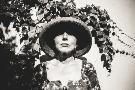 Posed woman sun hat gray sun photo