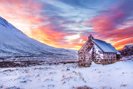 Dusk sky and clouds with house in Scotland photo