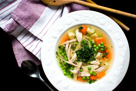 Homemade chicken broth with vegetables photo