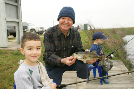 Children fishing with an adult at Lacassine National Wildlife Refuge photo
