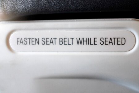 Fasten Seat Belt Sign on Plane photo