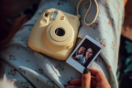 Woman Polaroid Camera photo