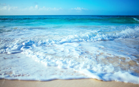 Closeup wave on the beach photo