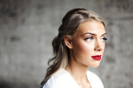 Portrait of Caucasian Blonde Woman with red Lips and Artificial Eyelashes photo