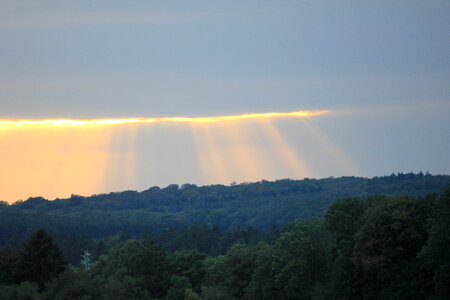 Orange sun breaks through the clouds