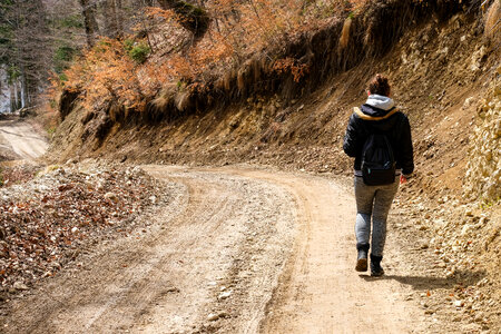 Girl Walking on a Mountain Path photo