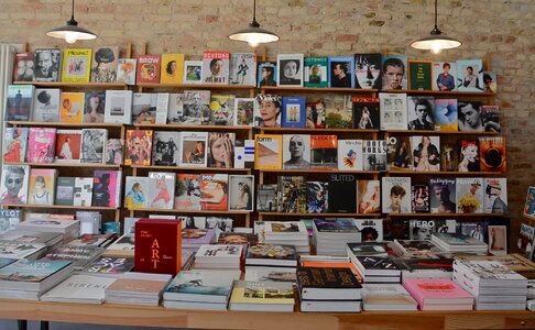 Rows of different colorful books lying on the shelves