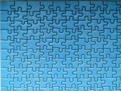 Piecing together pieces of the puzzle blue photo