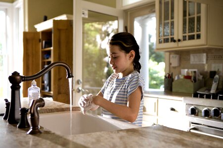 Cooking female child hands photo