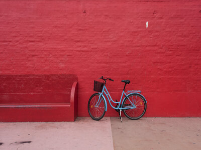 Blue Bicycle against Red Brick Wall photo