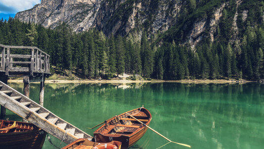 Pier and Rowboats on a Mountain Lake photo