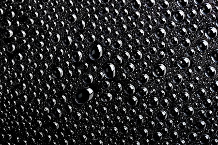 Black water drops macro background
