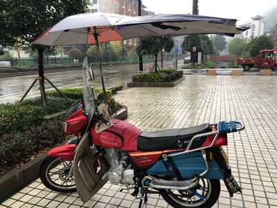 Asia moped rain photo