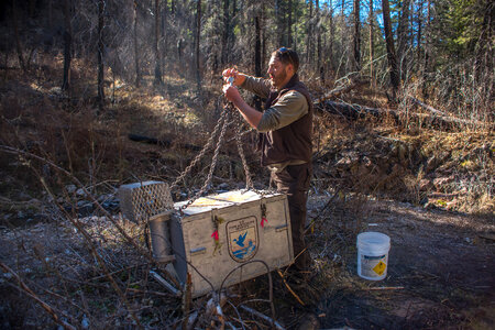 Biologist reattaches fish tank to helicopter cable-3 photo