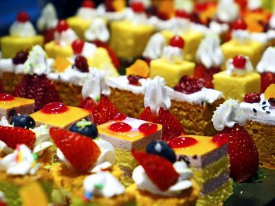 Diversity of pastry decorated with fruit photo