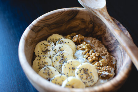 Oatmeal with chia seeds, banana and walnuts photo