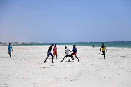 Children beach soccer riverbank photo