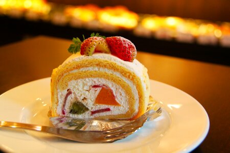 Berry roll cake on plate