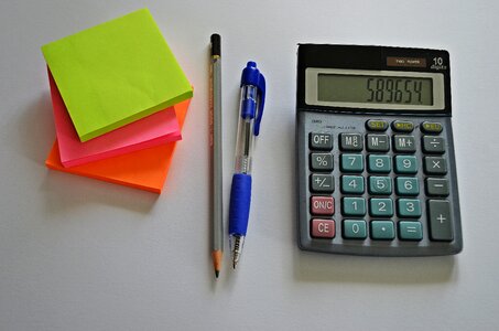 Calculator office supplies pen photo
