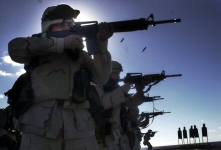 Marines practice live fire exercises on the fantail of the Mount