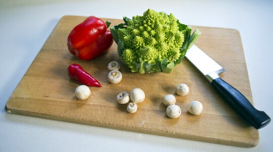 Button mushrooms chef's knife chopping board