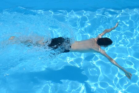 People swimming swimming pool