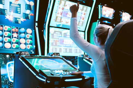 1 Happy woman playing at the casino photo