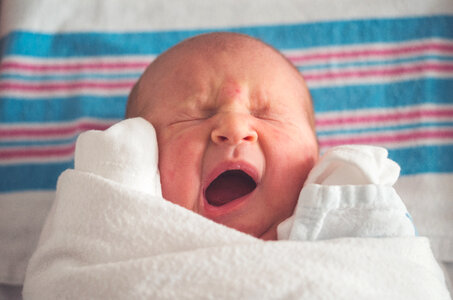 Newborn Baby Crying with Closed Eyes photo