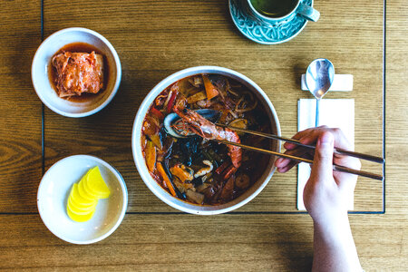 Eating Korean seafood stew photo