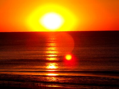 Ocean water sunset photo