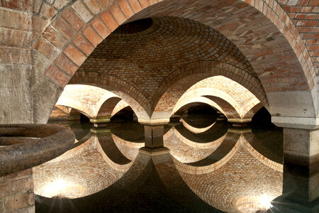 Arches over the water in the duct system in Warsaw photo
